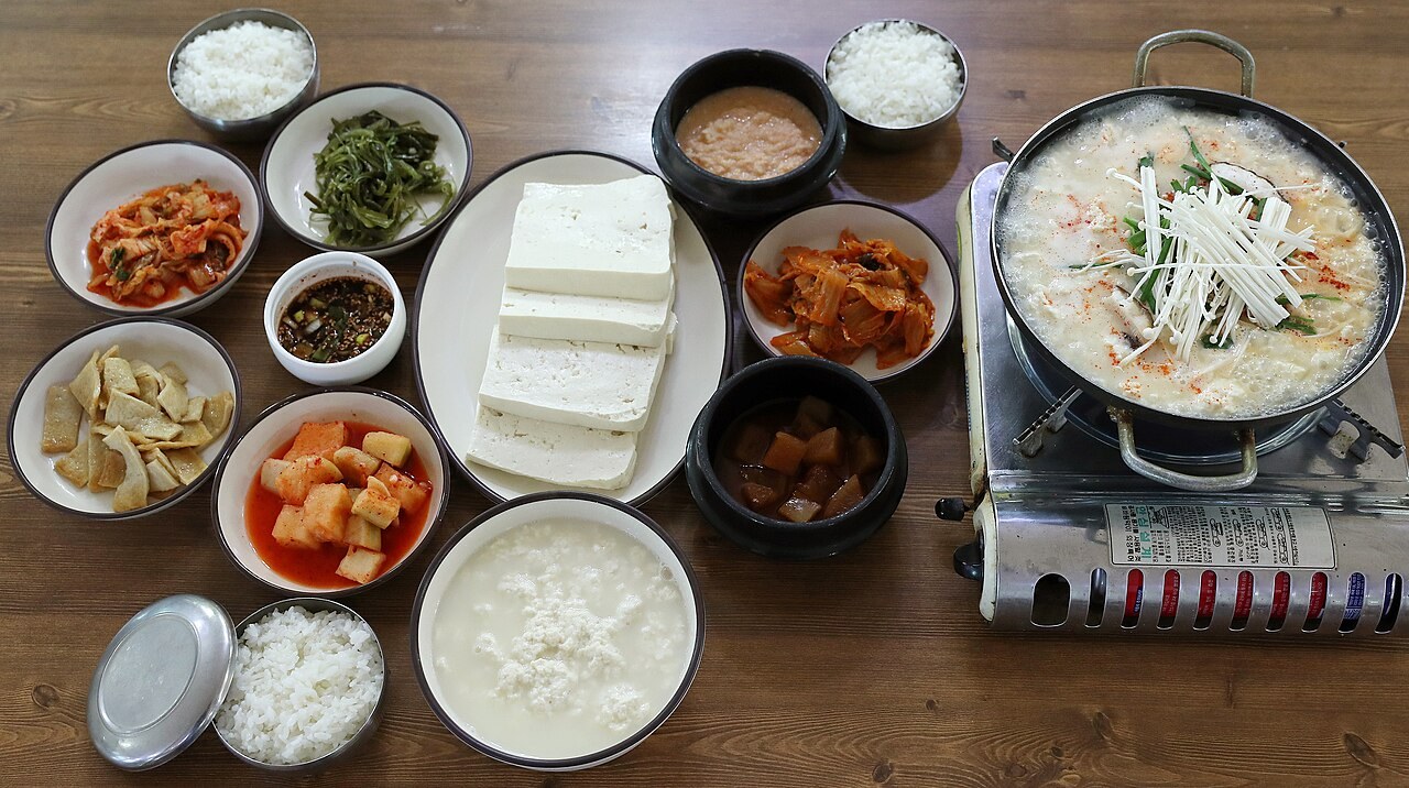 A chodang sundubu spread — soft tofu, a bubbling soft-tofu stew, rice and banchan, Gangneung