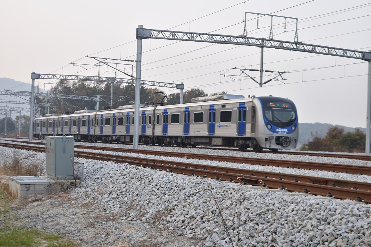 A blue-and-white Gyeonggang Line commuter train on the track near Yeoju